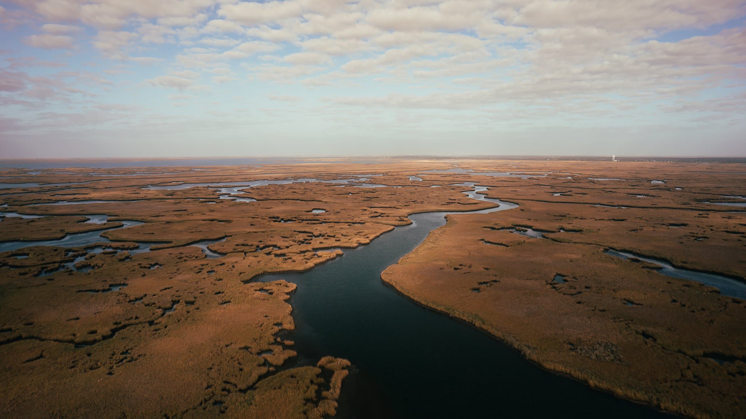 Aerial view of winding marsh channels near Port Sulphur, Louisiana redfish water.